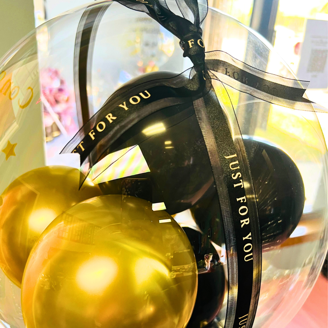 Close-Up Golden Glow Celebration Balloon Arrangement.