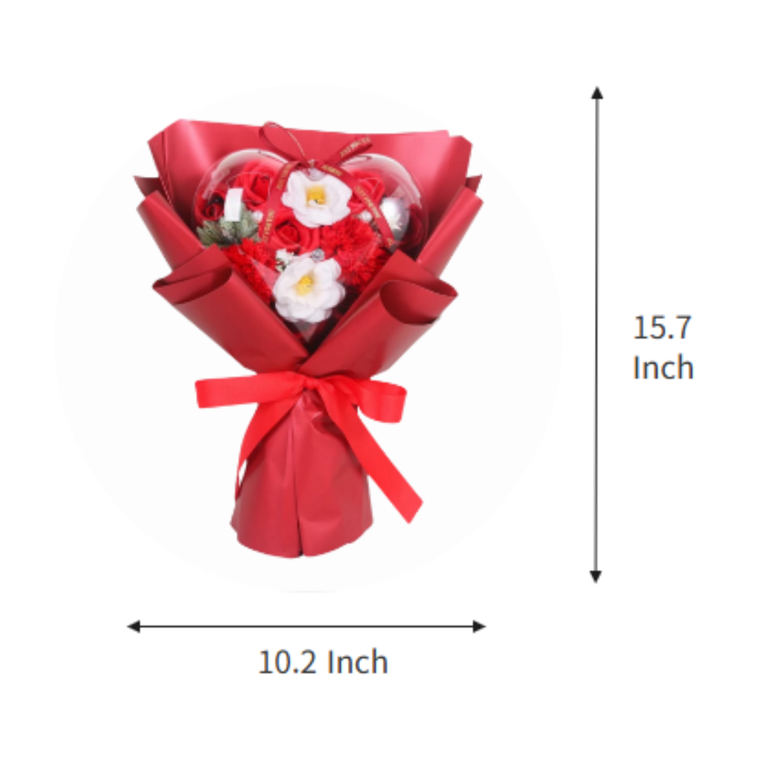 A red heart-shaped soap flower bouquet wrapped in a red ribbon with dimensions displayed as 15.7 inches tall and 10.2 inches wide.