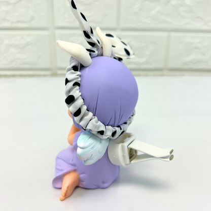 Side view of a purple-haired angel figurine with polka dot bunny ears, showing the attachment clip on its back.