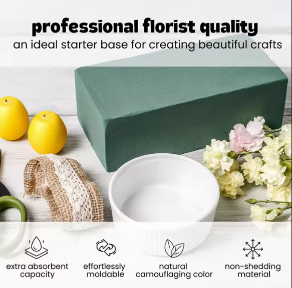 Wet floral foam block on a table with crafting materials, labeled with professional florist quality.