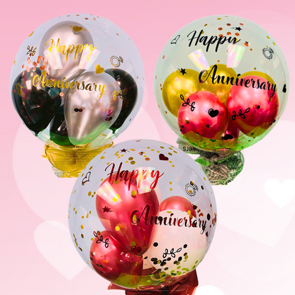 Anniversary Celebration BoBo Balloon  Celebrate your special day with our vibrant and heartfelt Anniversary BoBo Balloon. This hand-decorated, clear balloon with 5 colorful inside balloons and "Happy Anniversary" messages creates an eye-catching and memorable display for your special occasion.